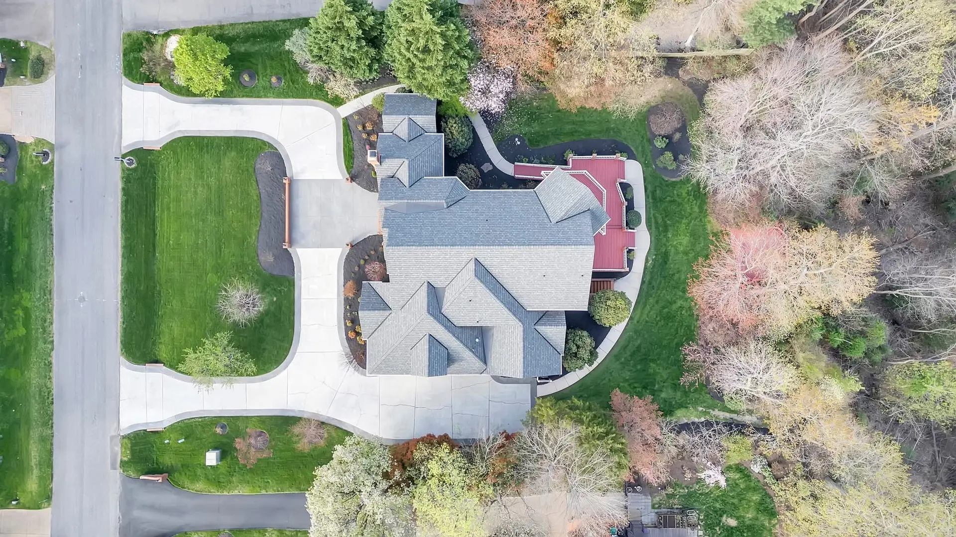 Aerial view of a completed architectural asphalt shingle roof installed by Dexica Construction in the Oregon Pacific Northwest